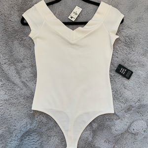 NWT. Express V neck cream color bodysuit. Size XS